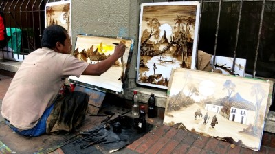 Street artist in Bogota. We bought two of his masterpieces for $10!