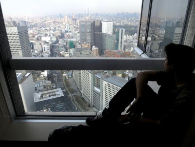 Shawn Reece enjoying the view from our 50th floor suite at the Park Hyatt Tokyo.